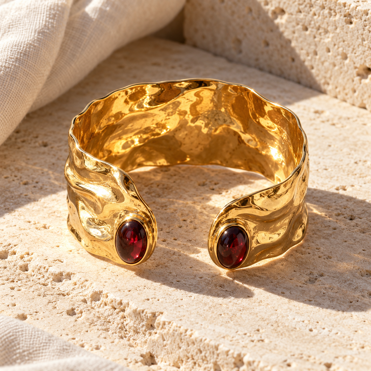 Organic hammered gold Remi open cuff with red garnet stones at both ends