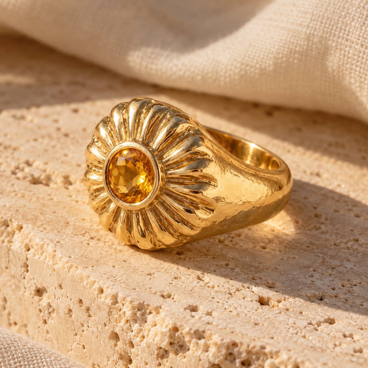 Jua sculptural gold ring with sunburst halo and round citrine
