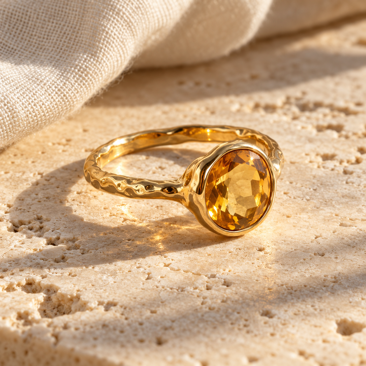 Asali gold ring with a honey-coloured oval citrine on ivory stone
